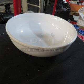 White 8-inch ceramic bowl in good condition, smooth surface, no visible chips or cracks.