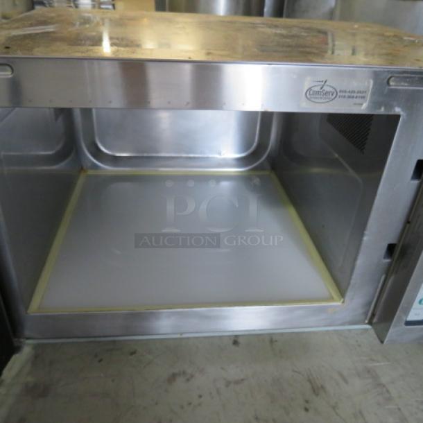 Amana RCS10TS stainless steel microwave, 120V, dimensions 22x16x14 inches. Visible interior with manufacturer label.