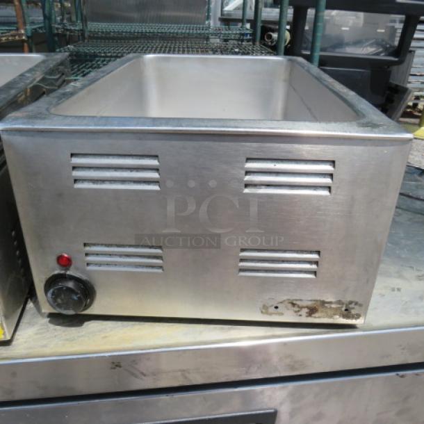 Adcraft FW-1200 food warmer, 120V, stainless steel, front knob control, red indicator light, used condition with visible wear.