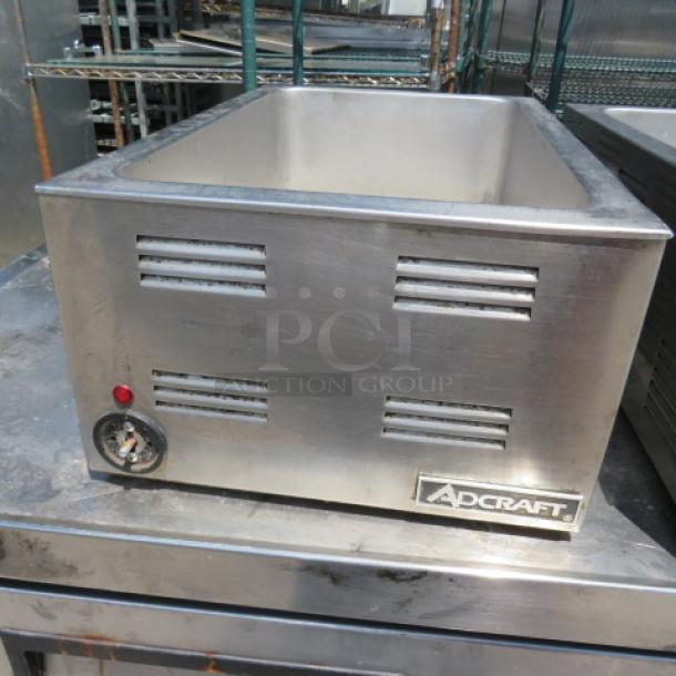 Adcraft FW-1200 food warmer, 120 Volt, stainless steel, good condition, visible Adcraft branding, dial control.