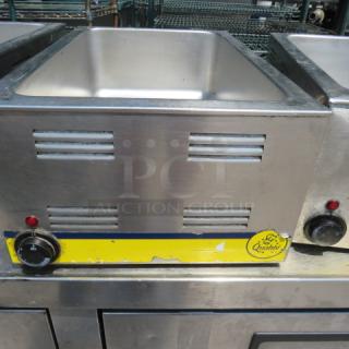 Adcraft One Qualite food warmer, Model FW-1200, 120 Volt. Stainless steel, visible wear. Controls and logo on front panel.