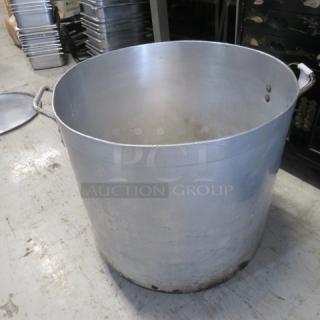 Aluminum stock pot, 19x18 inches, large capacity, used condition. Visible handles, slight wear at the base.