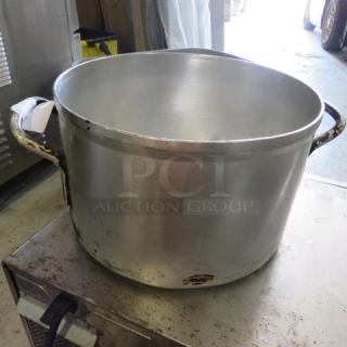 14 quart aluminum stock pot with dual handles, used condition, noticeable wear and surface marks.