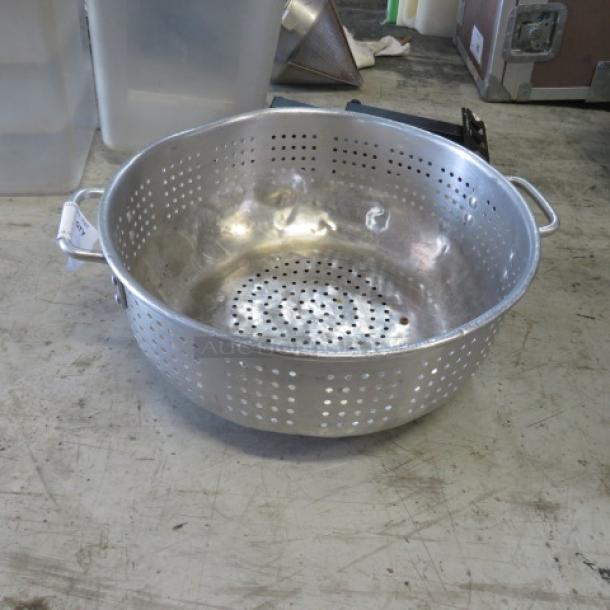 15-inch aluminum colander with perforated body and dual handles, in good condition, ideal for straining tasks.