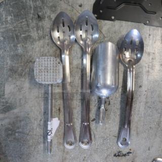 Lot of assorted metal utensils, including slotted spoons, a scoop, and a masher; used condition, visible wear.