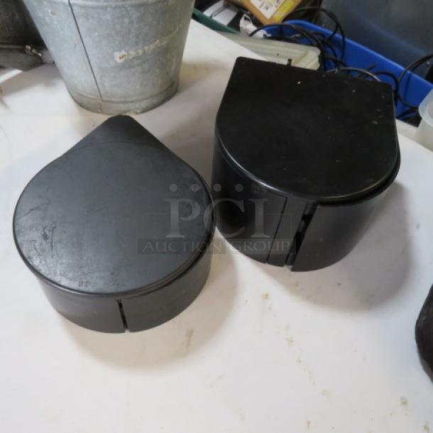Black Margarita Salter containers, teardrop-shaped, set of two, appear gently used, ideal for spice storage or décor.