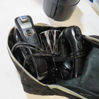 One lot of Oster hand mixers in a zippered black bag; includes two black mixers with attached cords and metal beaters, good condition.