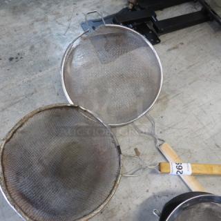 Mesh strainer set, 2XBID, round stainless steel, dual sizes, used condition with visible wear, wooden-handled grip.