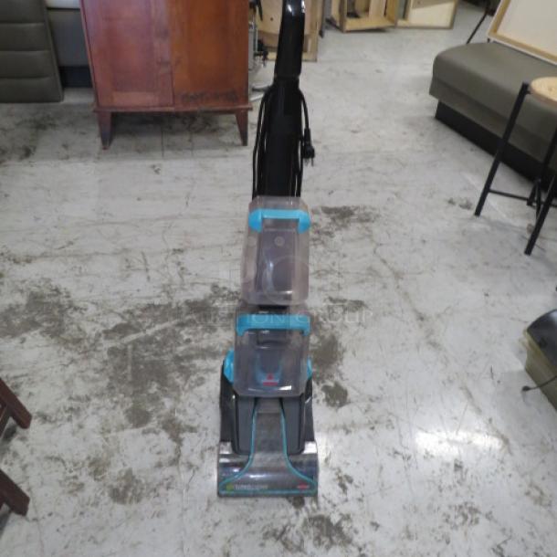Bissell Turbo Clean Power Brush Pet Carpet Cleaner in good condition, featuring dual water tanks and pet-specific cleaning technology.