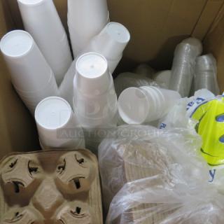 Box of disposable white and clear plastic cups, paper cup holders, and plastic bags. Suitable for take-out use.