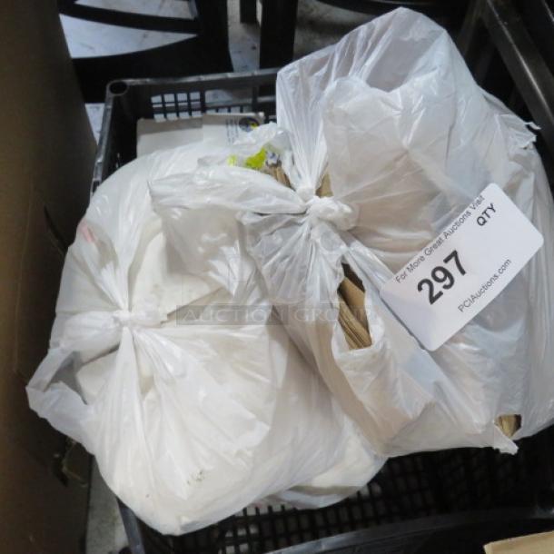 Lot of 2 items in plastic bags, auction tag reads "297 QTY." Condition and contents unknown.