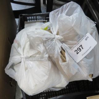 Lot of 2 items in plastic bags, auction tag reads "297 QTY." Condition and contents unknown.