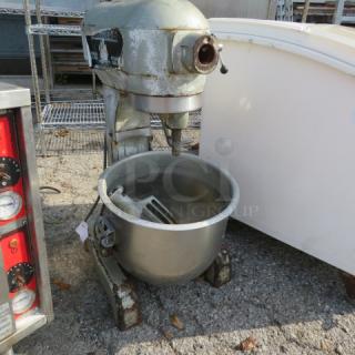 Hobart A-200 mixer with bowl and paddle, visible wear, used condition, includes model and make markings.
