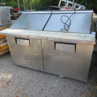 True 2 Door Refrigerated Prep Table, TSSU-60-24M-B-ST, cutting board, casters, 60x34x45, stainless steel, used condition.