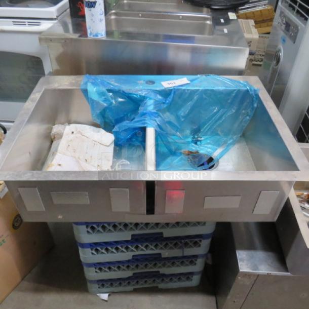 New stainless steel drop-in 2-compartment sink, 33x22x9 inches, with protective blue film, no visible wear.