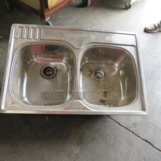 Stainless steel drop-in sink, two compartments, 33x22 inches, new condition.