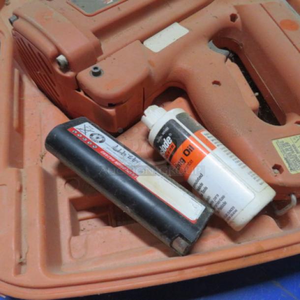 Paslode Cordless 30 Degree Framing Nailer, includes case, fuel cell, and oil. Appears in used condition; visible wear.