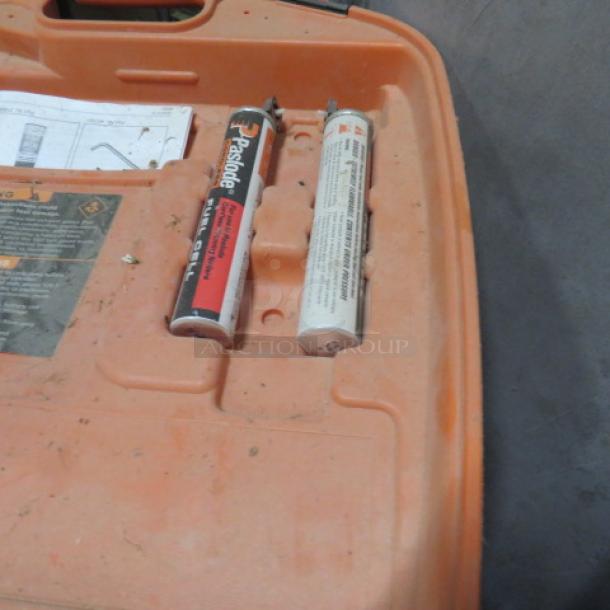 Paslode Cordless 30 Degree Framing Nailer in orange case, includes two fuel cells and manual. Case shows minor wear.