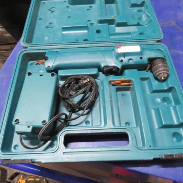 Makita cordless angle drill DA391A in carry case with charger. Drill shows light wear. Case has molded compartments for storage.