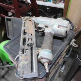 Hitachi nail gun in used condition, showing signs of wear. Features a metallic body with visible brand markings.
