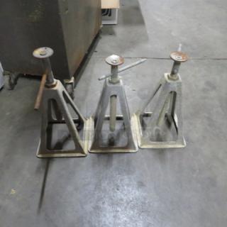 Three steel jack stands with triangular bases, 3XBID model. Used condition with visible rust and wear.