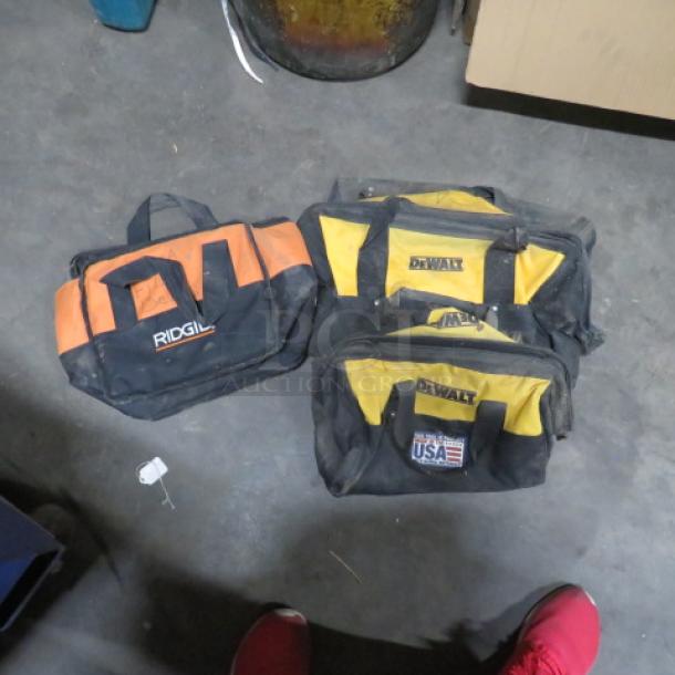 Assorted tool bags, including Ridgid and DeWalt. Used condition, visible logos, variety of sizes and colors.