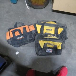 Assorted tool bags, including Ridgid and DeWalt. Used condition, visible logos, variety of sizes and colors.