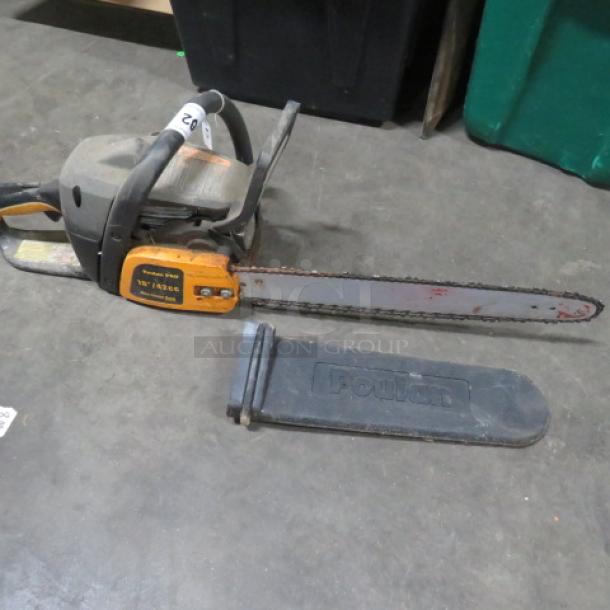 Poulan 18-inch chainsaw with protective blade cover, used condition, visible model markings on side, ideal for auctions.