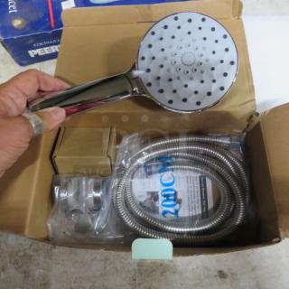 New Kiieyna shower head shown with packaging. Includes chrome handheld unit, hose, and mounting brackets.
