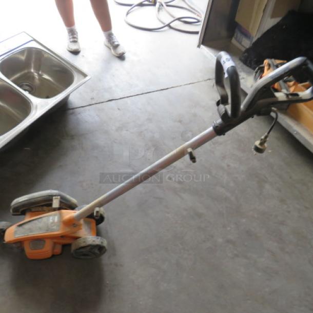 WORX Cordless Edger, model #WG396, 120V. Features adjustable handle. Used condition.