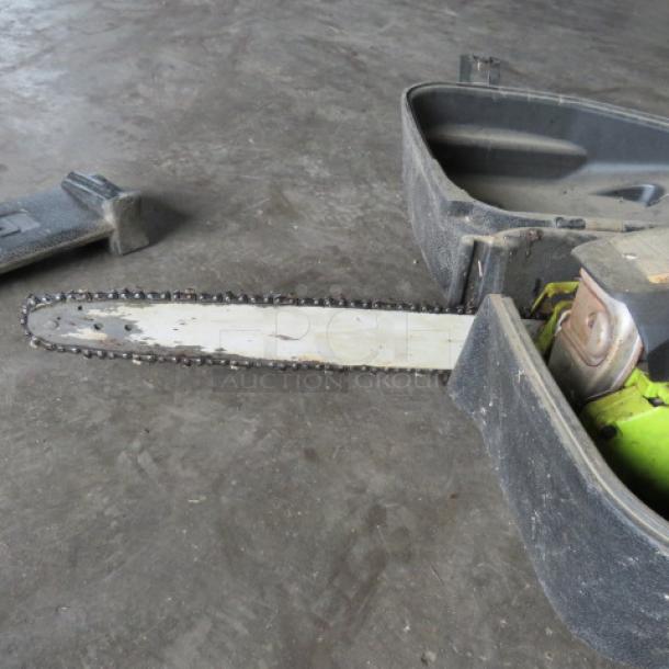 Poulan chainsaw in a black case; appears lightly used with visible wear on the blade.