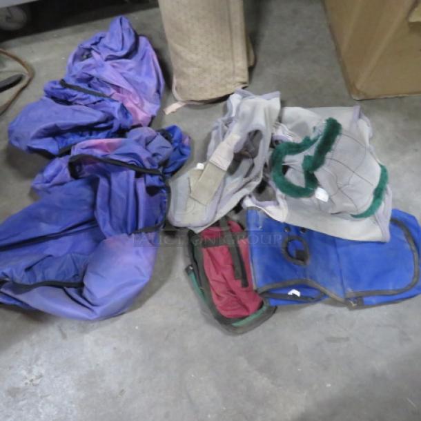 Lot of miscellaneous textiles and gear, including purple and blue fabric, mesh material, and bags. Used condition.