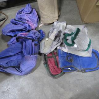 Lot of miscellaneous textiles and gear, including purple and blue fabric, mesh material, and bags. Used condition.