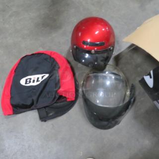 Red motorcycle helmet with black visor, BILT helmet bag, and extra clear and tinted shields. Good condition.