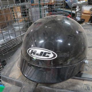 Large HJC Motorcycle Helmet CS-2N, black, used condition, visible logo on front.