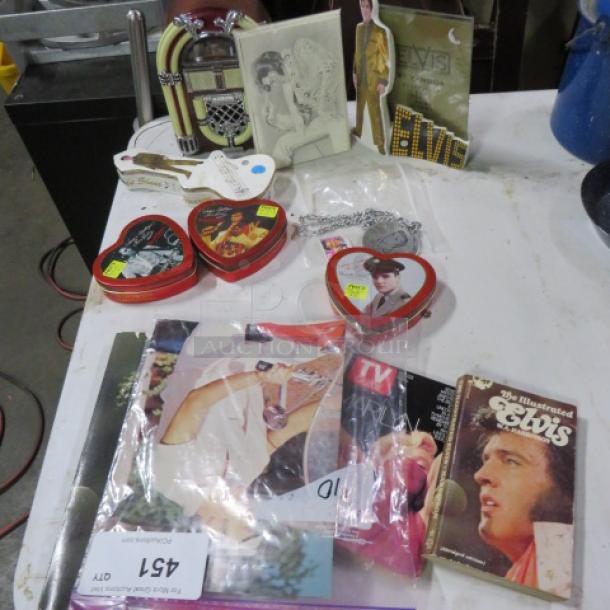 One lot of Elvis and Marilyn Monroe collectibles, including heart-shaped tins, booklets, and novelty items, various conditions.