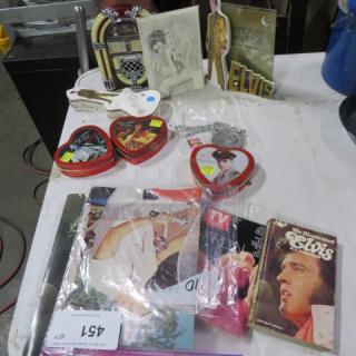 One lot of Elvis and Marilyn Monroe collectibles, including heart-shaped tins, booklets, and novelty items, various conditions.