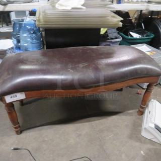 Wooden bench with cushioned seat, dark brown leather upholstery. Minor wear, sturdy turned legs. Auction tag reads "459".