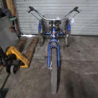 Vintage Schwinn Meridian tricycle, blue, with rear basket. Features upright handlebars and durable tires. Good condition.