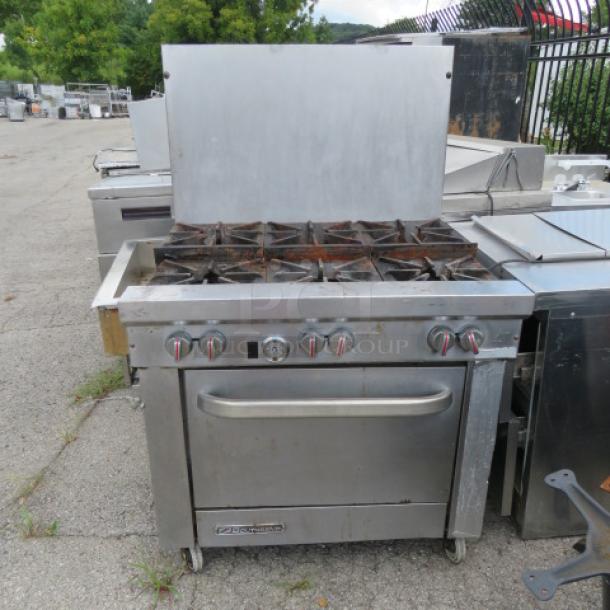 Southbend S361D natural gas 6-burner range on casters, features 1 rack, used condition, visible wear, model label present.
