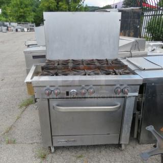 Southbend S361D natural gas 6-burner range on casters, features 1 rack, used condition, visible wear, model label present.