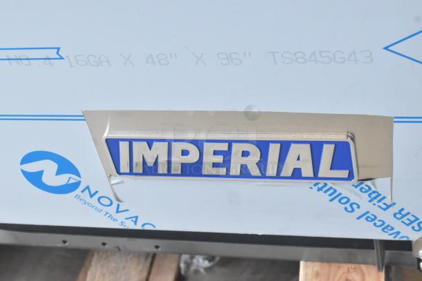 Brand new Imperial stainless steel 10-burner hot plate range with ovens. Scratch and dent model, includes overshelf and backsplash.