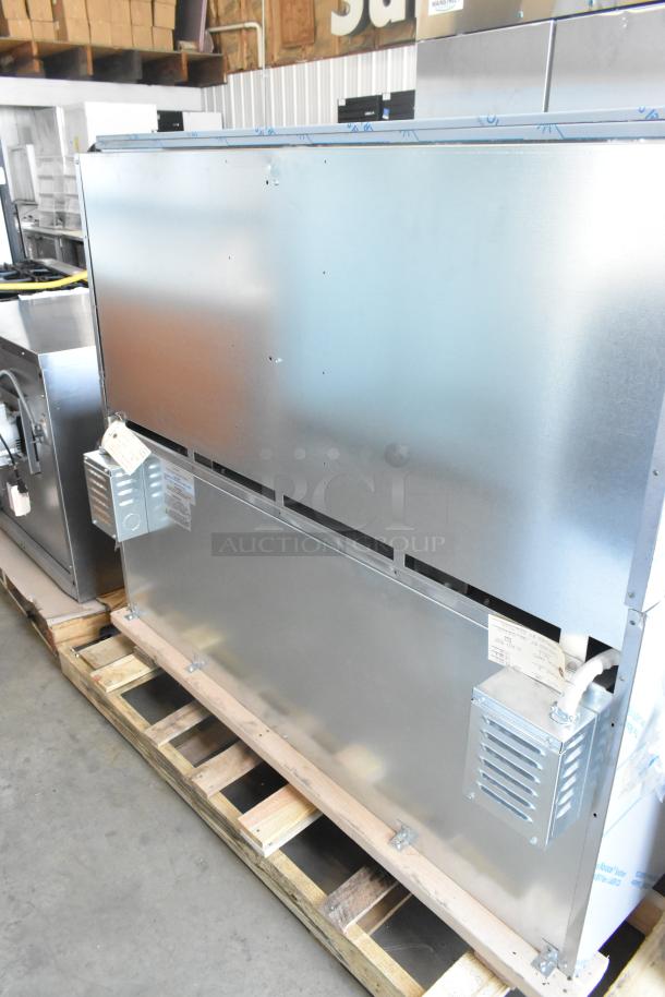 Stainless steel Imperial 10-burner hot plate range with 2 ovens, over shelf, back splash; new scratch and dent condition.