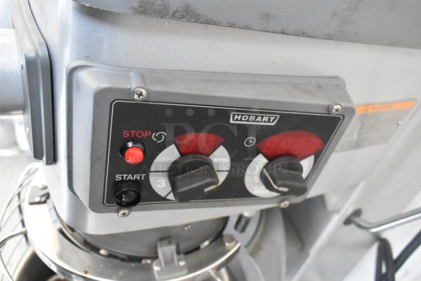 Hobart Legacy HL400 commercial dough mixer control panel, featuring stop/start buttons and dial controls.