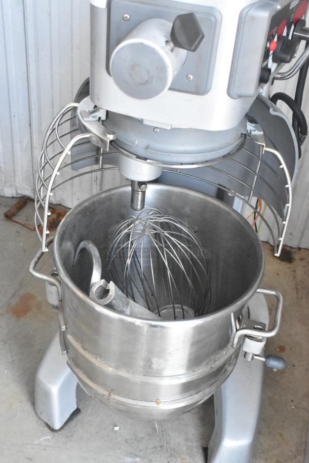 Hobart Legacy HL400 commercial 40-quart dough mixer with stainless bowl, bowl guard, whisk, and dough hook attached.