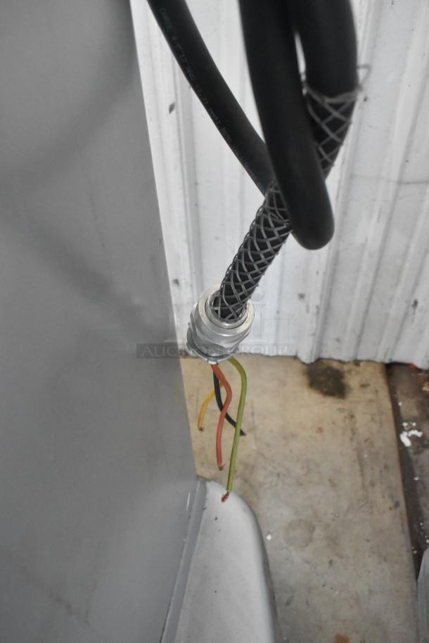 Industrial power cord of Hobart HL400 mixer with exposed colored wires, highlighting electrical connection condition.