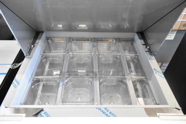 Brand new Beverage Air SPE27HC-12M stainless steel prep table. Scratch and dent condition. Includes clear food pans.