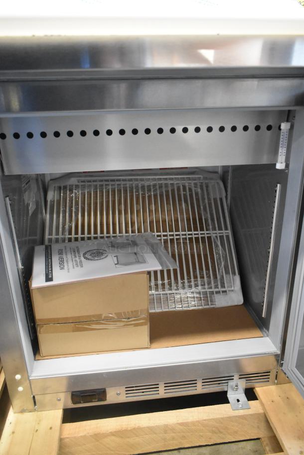 Beverage Air SPE27HC-12M stainless steel prep table, scratch and dent condition, new, includes shelves and manual, 115V, 1 phase.