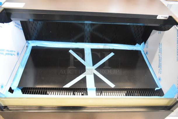 Brand new Structural Concepts CO3324R air curtain merchandiser, 120V, 1 phase. Some scratches and dents visible.