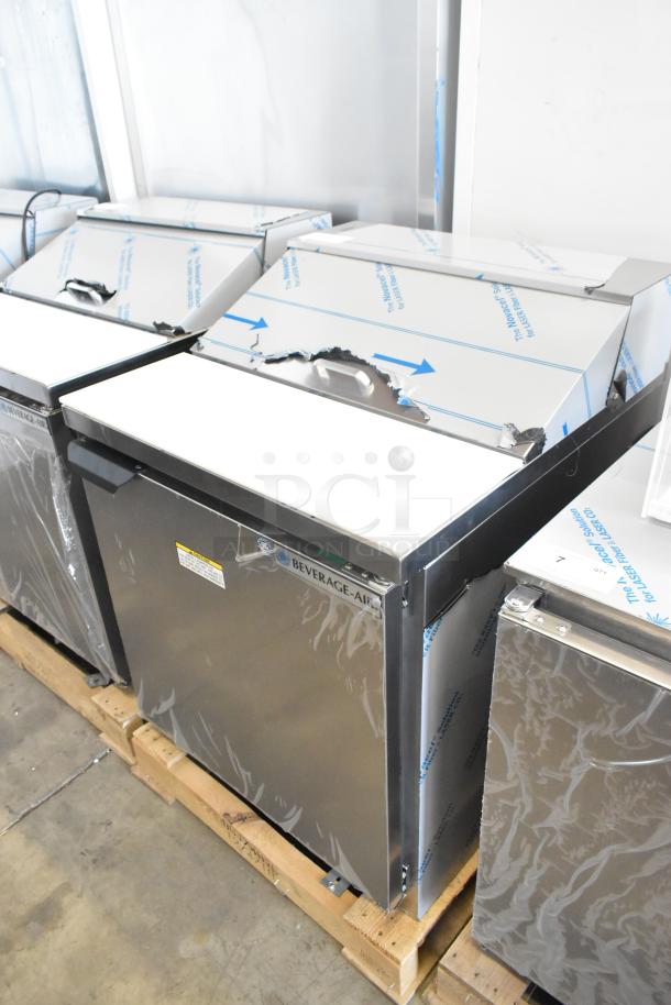 Brand new Beverage Air SPE27HC-B stainless steel sandwich salad prep table, scratch and dent condition, 115V, 1 Phase.